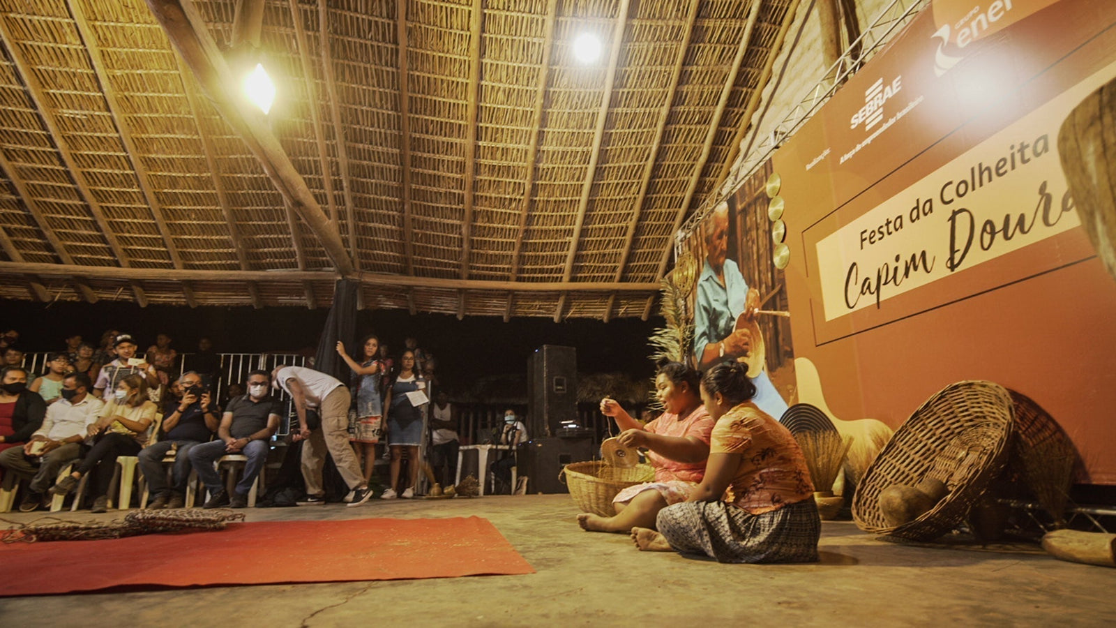 Artisans weaving capim dourado during the Capim Dourado Harvest Festival in Quilombo Mumbuca, Jalapão, Brazil. A cultural celebration of golden grass craftsmanship and quilombola traditions