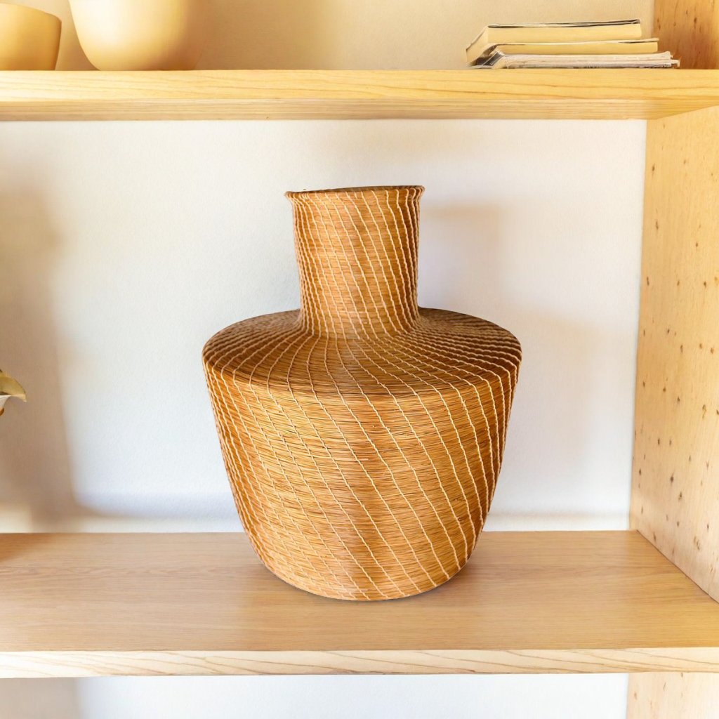 A beautiful vase made of golden grass, perfect decoration piece