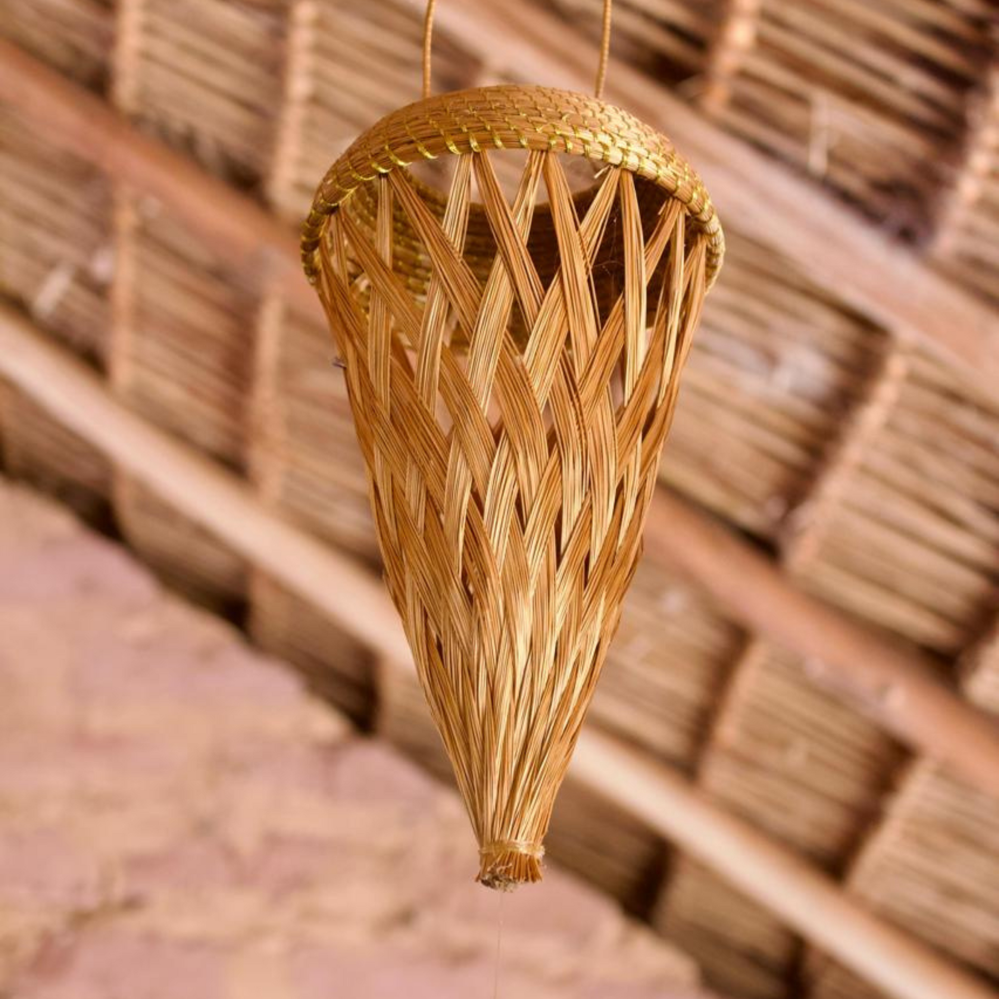 Handmade golden grass luminaire for sustainable home décor, crafted by Brazilian artisans