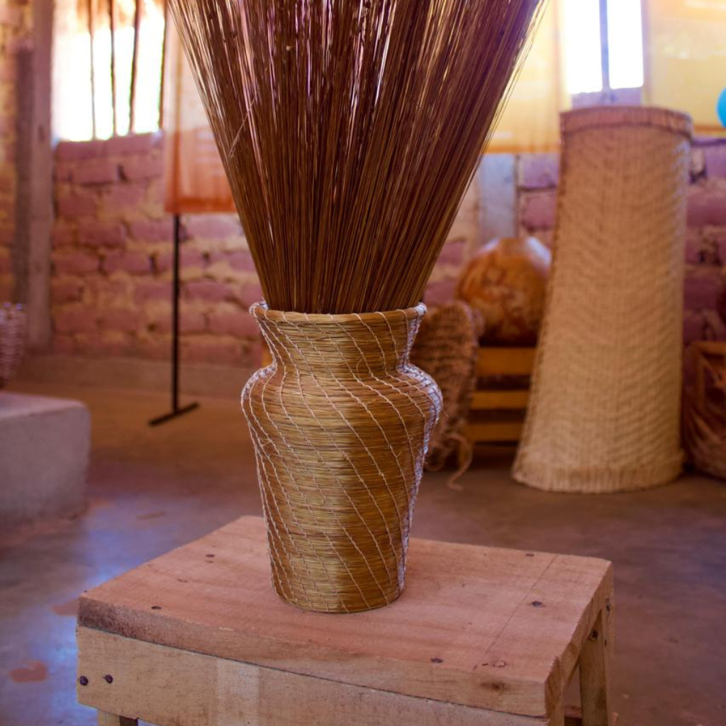 Handwoven golden grass vase, sustainable home décor made by Brazilian artisans