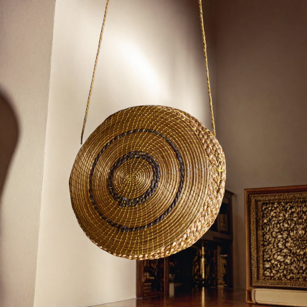 Handwoven oval golden grass bag with stripes, sustainable boho accessory from Brazil